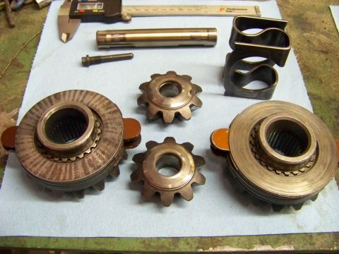 1999 Mercury Grand Marquis - Tools and differential components are arranged on a workbench, suggesting a repair or rebuild process.