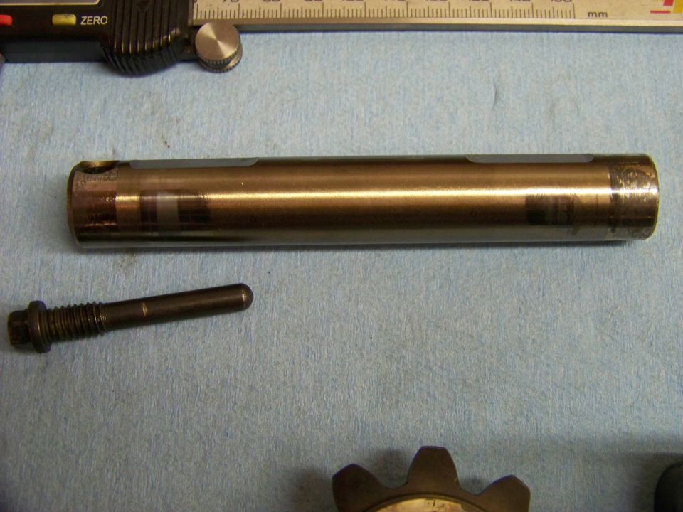 Metal shaft and bolt with caliper and ruler