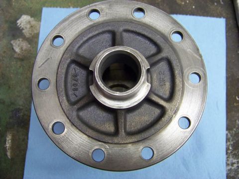 1999 Mercury Grand Marquis - Close-up of a metal differential cover, likely for a vehicle part rebuild.