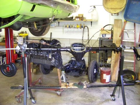 1999 Mercury Grand Marquis - Rear axle assembly being worked on in a garage setting.