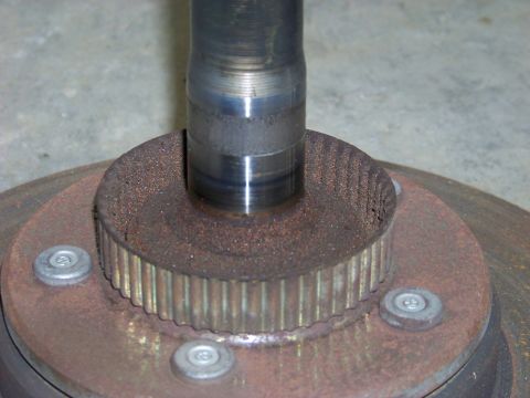 1999 Mercury Grand Marquis - Close-up of a rusted wheel hub with splines and mounting bolts.
