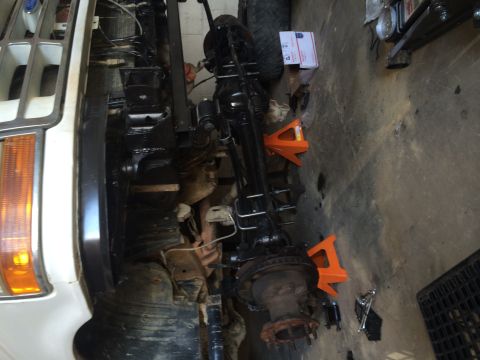 1994 Ford Bronco - Front axle assembly of a 1994 Ford Bronco undergoing work.