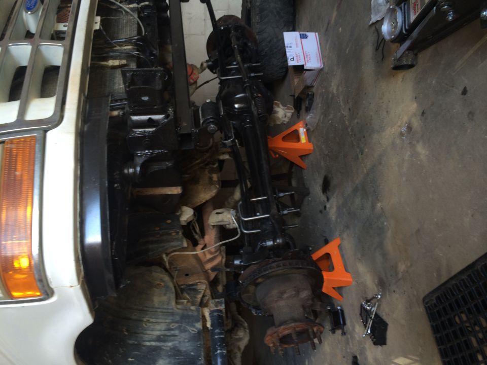 1994 Ford Bronco front axle assembly on jack stands