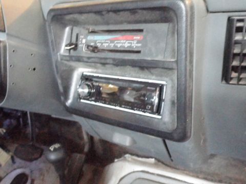 1990 Ford Bronco - Interior view of a car's dashboard, showing the radio and air conditioning controls.