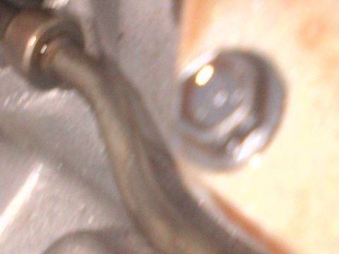 1978 Ford Bronco - A detailed view of a vehicle's transmission part, showing mechanical components.