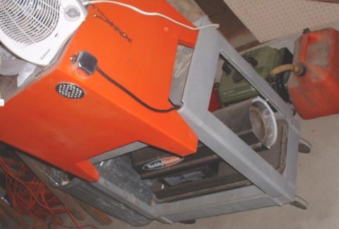 1986 Ford Bronco - A Reddy Heater portable heater is visible, along with a fan and a red gas can.
