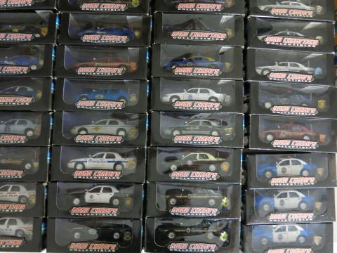 1991 Ford LTD Crown Victoria - A collection of 'Road Champs' collectible model cars are displayed in their original packaging.