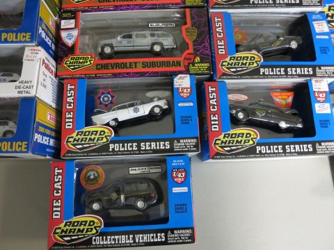 1991 Ford LTD Crown Victoria - Collection of boxed die-cast police car models from Road Champs, various vehicles.