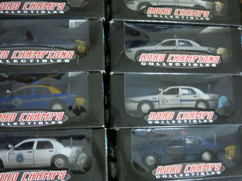1991 Ford LTD Crown Victoria - Collection of Road Champs collectible model cars, some appearing to be police vehicles.