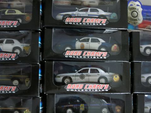 1991 Ford LTD Crown Victoria - Collection of police car models in packaging, including a 1992 Ford Crown Victoria.