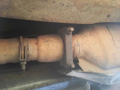 1996 Ford Bronco - Underside view of a vehicle's exhaust system, showing a catalytic converter and pipe.