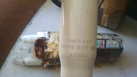 1978 Ford Bronco - A cream-colored part, stamped "MADE IN U.S.A." and with various numbers, is shown in detail.