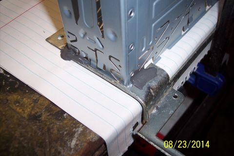 1978 Ford Bronco - Close-up of a metal bracket and paper, with a date stamp visible in the corner.