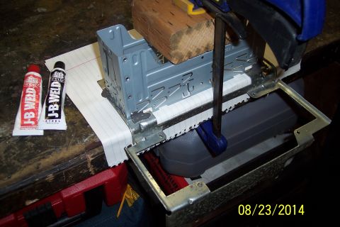 1978 Ford Bronco - A metal bracket is being worked on with JB Weld and clamps.