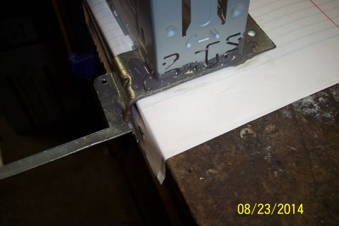 1978 Ford Bronco - Close-up of a metal bracket with handwritten notes on paper, attached with sealant.