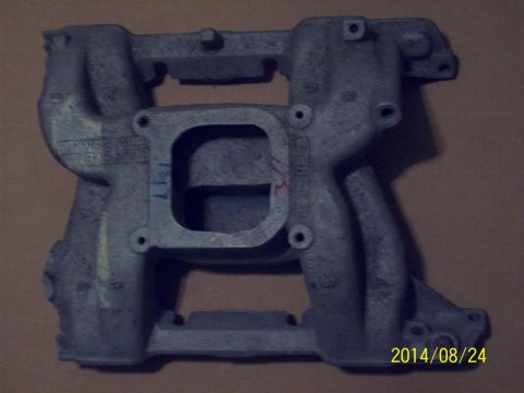 1969 Ford Torino - A gray metal intake manifold is shown against a plain background.