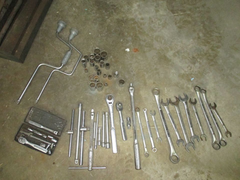 Collection of socket wrenches, ratchets, and extension bars