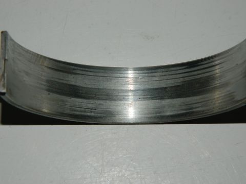 1979 Ford Bronco - This engine bearing shows significant wear and scoring, indicating potential internal engine damage.