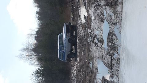 1979 Ford Bronco - This 1978 Ford Bronco is stuck in a muddy trail, showing its side profile.
