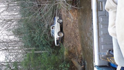 1979 Ford Bronco - This 1979 Ford Bronco is seen on a dirt path near a body of water.