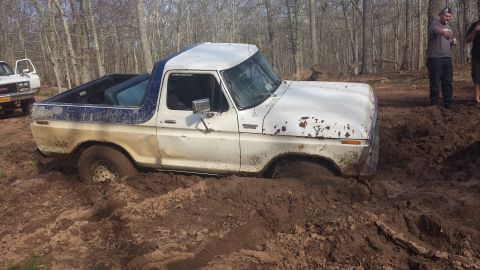 1979 Ford Bronco - This 1978 Ford Bronco is stuck in the mud with another vehicle nearby.