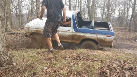 1979 Ford Bronco - Ford Bronco stuck in mud during an off-road excursion.