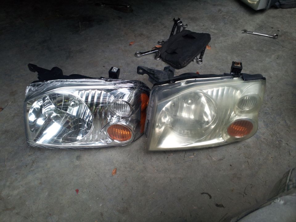 2003 Nissan Frontier headlights, one new, one used