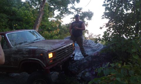 1979 Ford Bronco - This 1979 Ford Bronco is positioned on a rocky incline, with a person standing next to it.