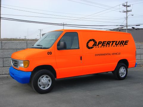 1994 Ford Bronco - This orange van features the Aperture Laboratories logo and is labeled as an 'Experimental Vehicle'.