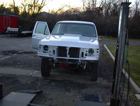 1990 Ford Bronco - This 1987 Ford Bronco is missing its grille and headlights, and has an aftermarket hood scoop.