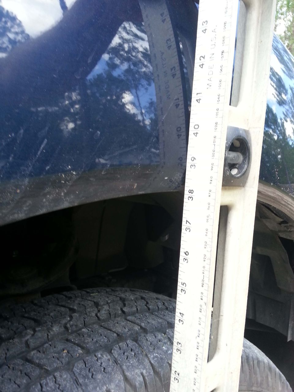 Measuring the height of a vehicle's tire and suspension with a level and ruler
