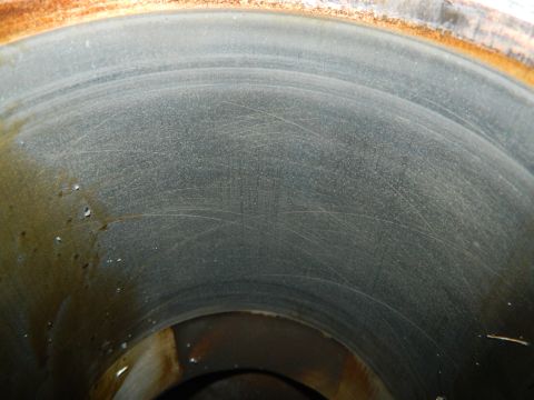 1979 Ford Bronco - Close-up of a cylinder wall showing wear marks and oil.
