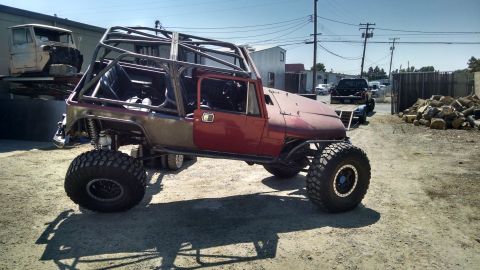 1985 Jeep CJ7 - This heavily modified Jeep CJ features a custom roll cage and oversized off-road tires.