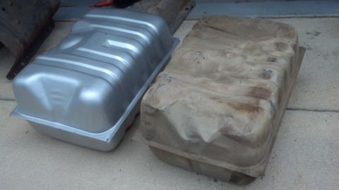 1995 Ford Bronco - Comparison of a new silver fuel tank next to an old, corroded one.