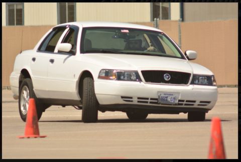 2000 Mercury Grand Marquis - White 2000 Mercury Grand Marquis navigating a course marked by traffic cones.