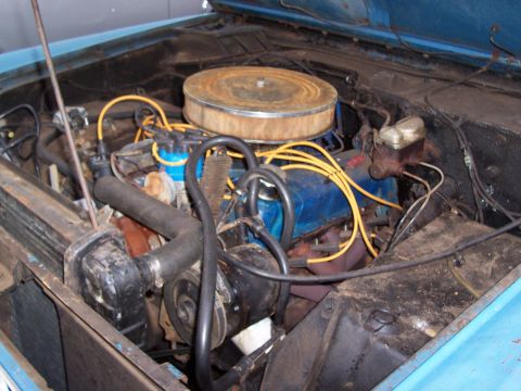 1969 Ford Bronco - Close-up view of the engine compartment, showing various mechanical components and wiring.
