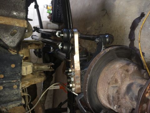 1994 Ford Bronco - This is a close-up view of the steering linkage on a vehicle's front axle.
