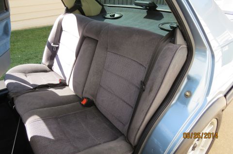 1990 Volkswagen Jetta - Interior view of car's rear seat with seatbelts visible. Date stamp present.