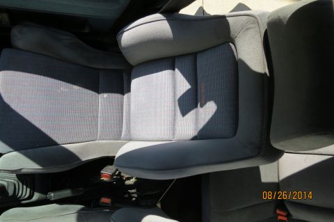 1990 Volkswagen Jetta - Interior view of gray fabric car seats with visible orange stitching detail and seat belts.