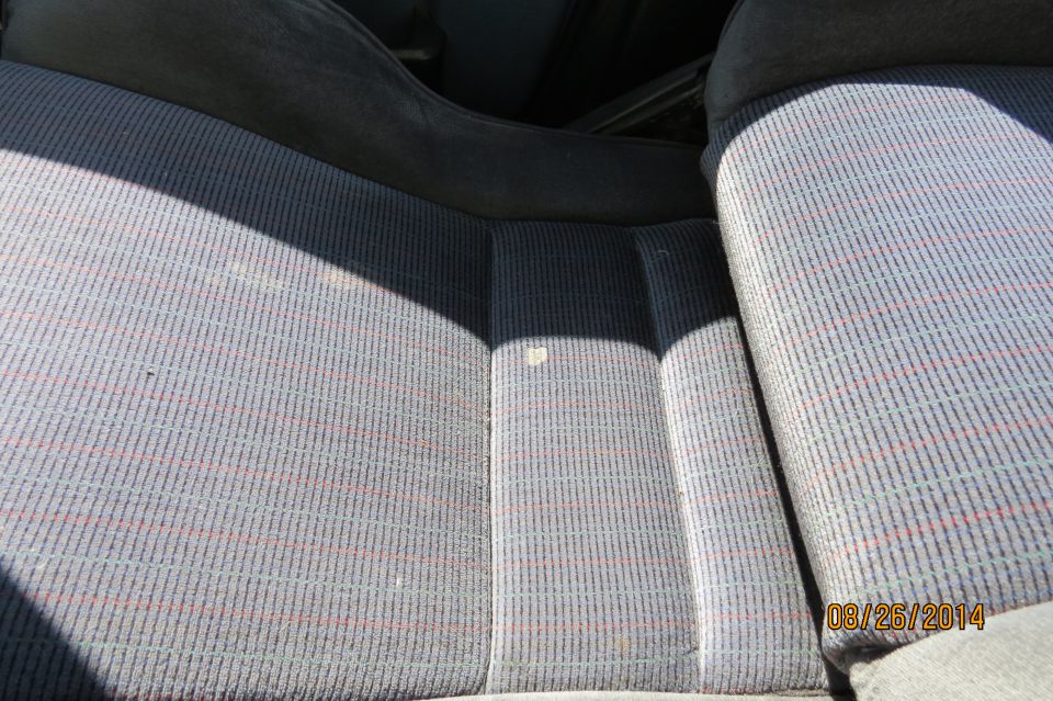 Car interior seats with striped fabric. Date stamp on photo reads 08/26/2014