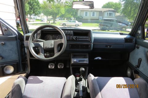 1990 Volkswagen Jetta - Interior view of a 1990 Volkswagen Jetta, showing the dashboard, steering wheel, and seats.