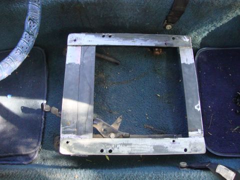 1972 Ford Pinto - Close-up of an interior seat mounting bracket, showing its construction and adjustment mechanism.