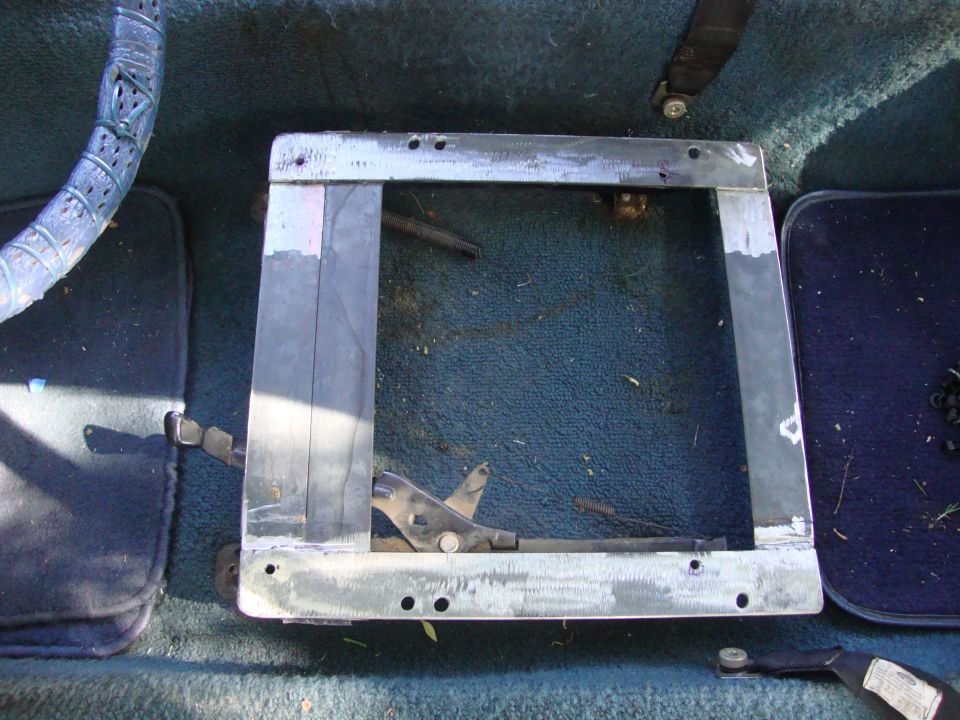 Interior seat mounting bracket with visible adjustment lever