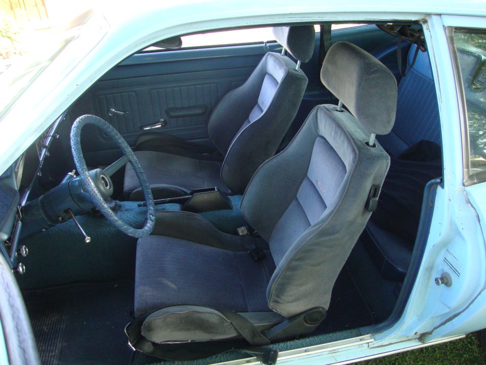 1972 Ford Pinto interior showing front bucket seats, dashboard, and steering wheel