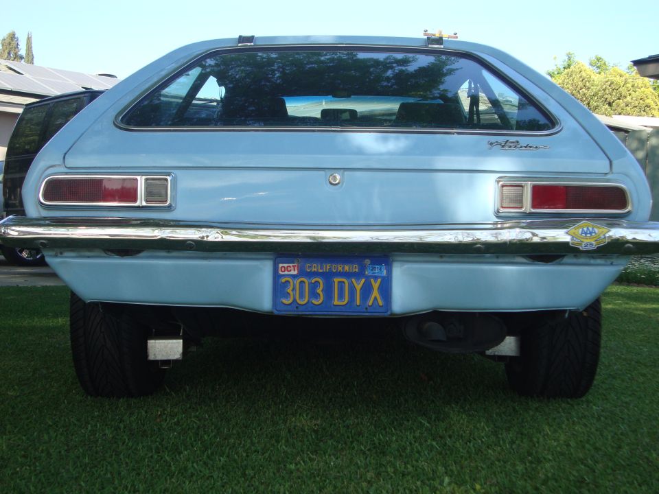 Light blue 1972 Ford Pinto hatchback rear view with California license plate 303 DYX
