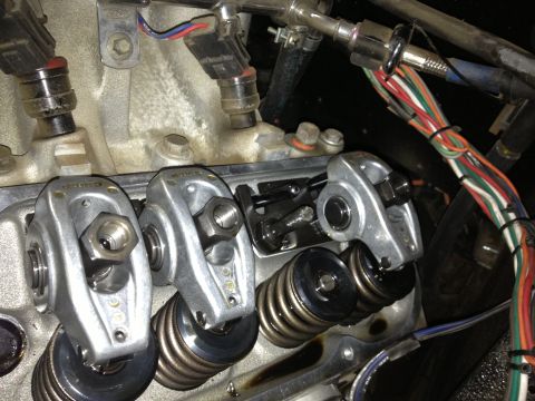 1961 International Scout 800 - Close-up view of an engine's valve train components, including rocker arms and valve springs.