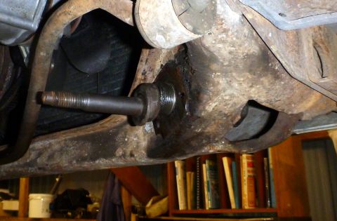 1964 Mercury Monterey - Close-up of a rusty car suspension component with a threaded stud visible.