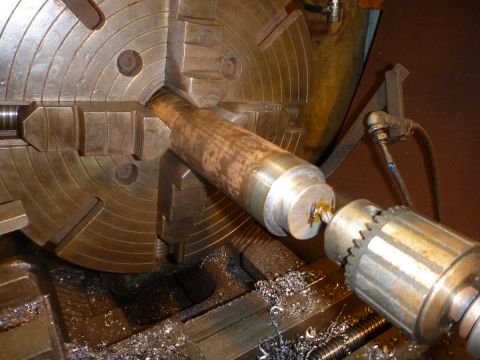 1964 Mercury Monterey - A metal rod is being shaped and cut on a metal lathe with metal shavings accumulating.
