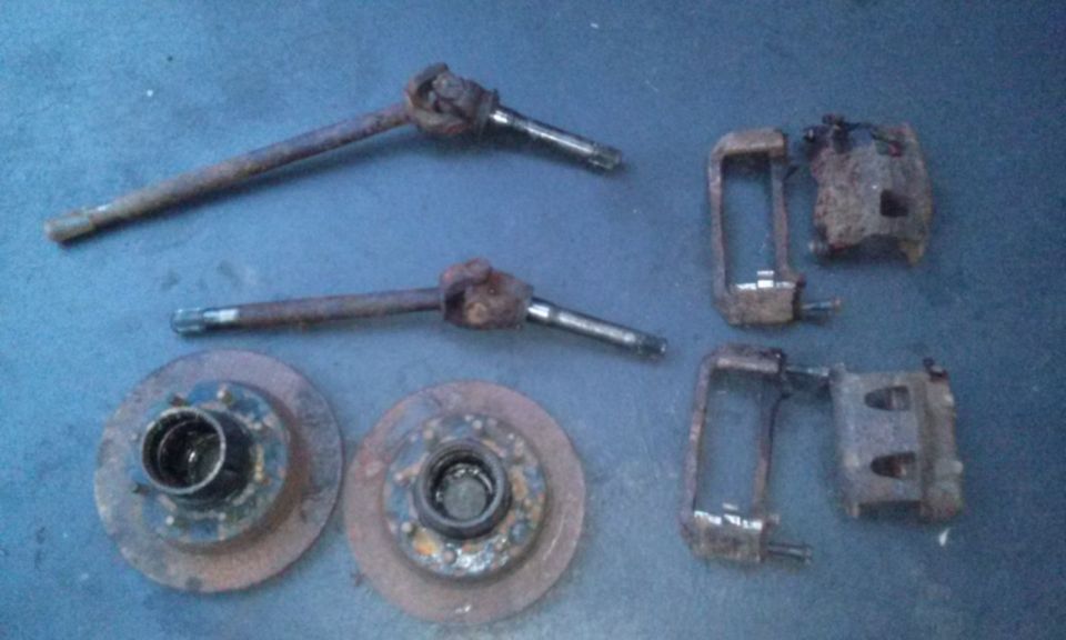 Two brake rotors and two sets of brake calipers and spindles
