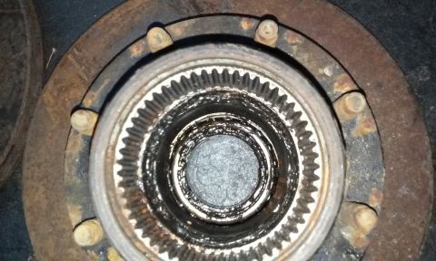 1994 Ford Bronco - Close-up view of a wheel hub assembly, showing the internal splines and mounting hardware.
